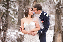 Air Force Wedding Couple Kiss in Snow Near Colorado Springs