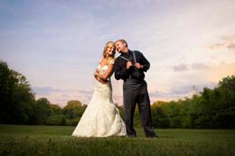 Bride and Groom pose back to back at sunset