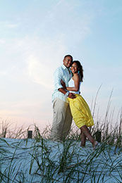 Engaged couple embrases as the sun sets in Destin, Florida