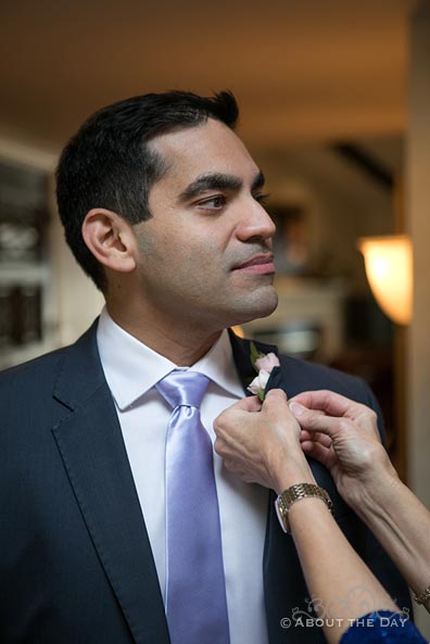 Heather's mother pins on Naveed's boutonniere