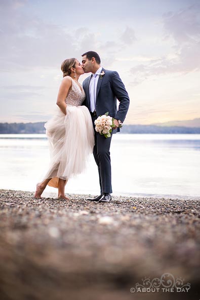 Heather and Naveed kiss on the beach in Olympia